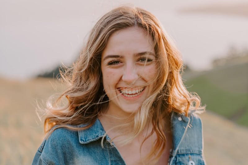 A smiling woman in a field