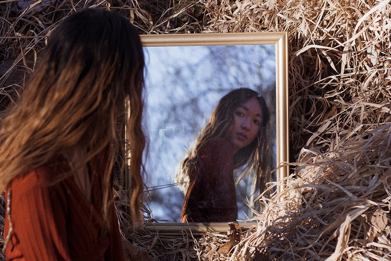 Woman reflected in a mirror